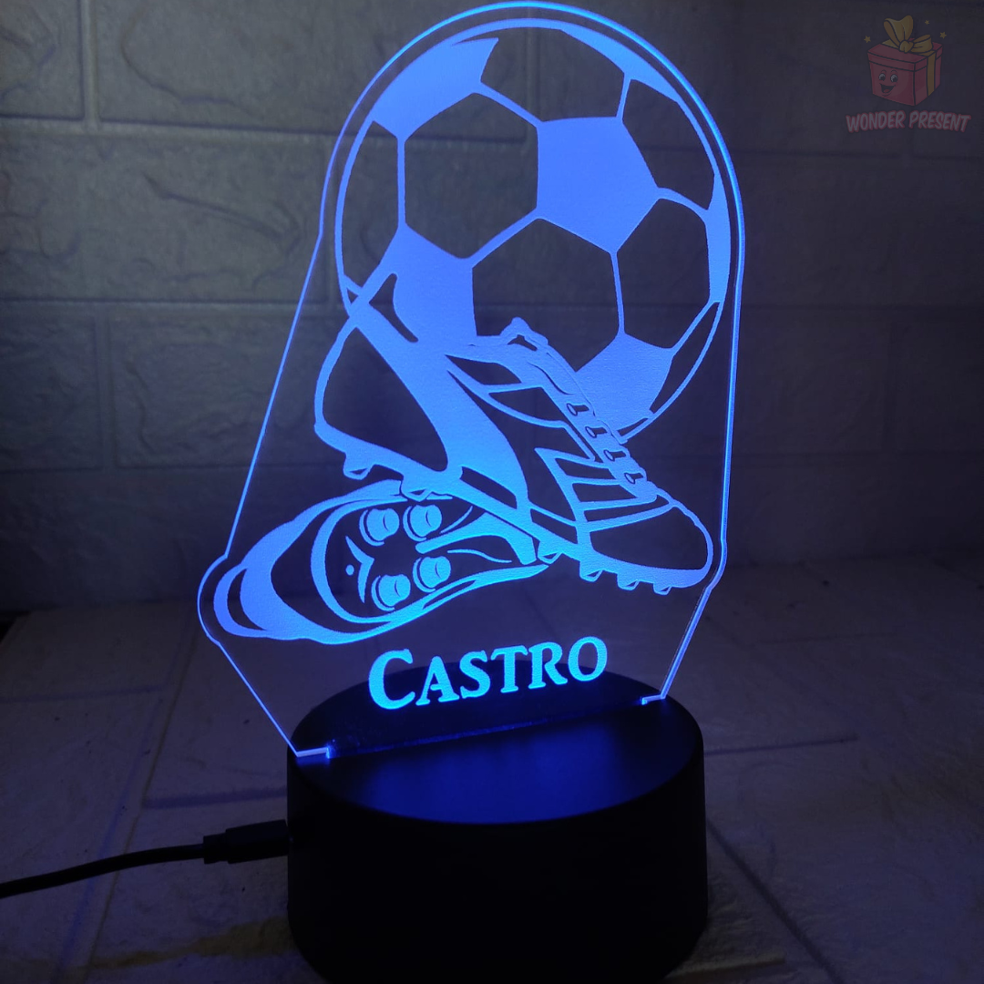 Chuteiras de futebol e lâmpada 3D de bola