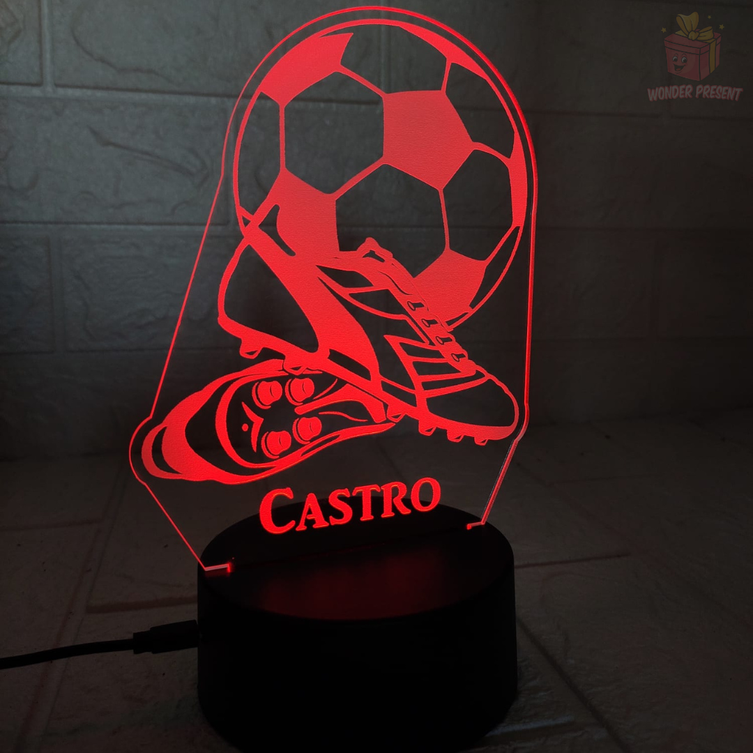 Chuteiras de futebol e lâmpada 3D de bola